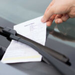Traffic Blitz After Fire—Locals FURIOUS Hand retrieving parking ticket from car windshield