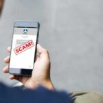 Fake Ads EXPLODE Online — Scammers Go High-Tech Person reading a scam message on a smartphone