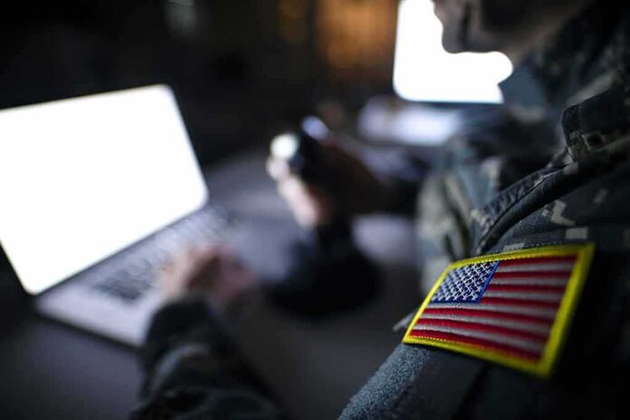 1395036650 featured image Soldier using laptop with US flag patch visible