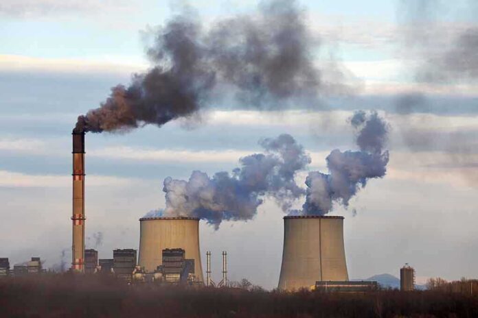 1555865300 featured image Industrial plant emitting black smoke into the sky