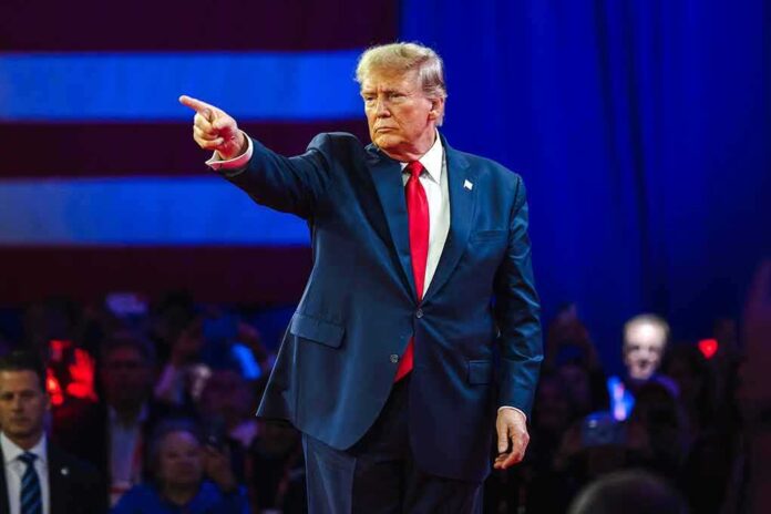 2430065795 featured image Person in suit pointing during a public event
