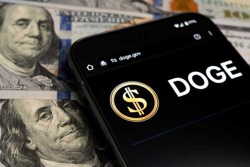 2591039935 featured image Smartphone displaying Doge logo over dollar bills