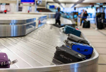 Luggage on airport baggage claim conveyor belt