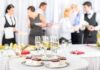 A table set with champagne glasses and desserts at a social event