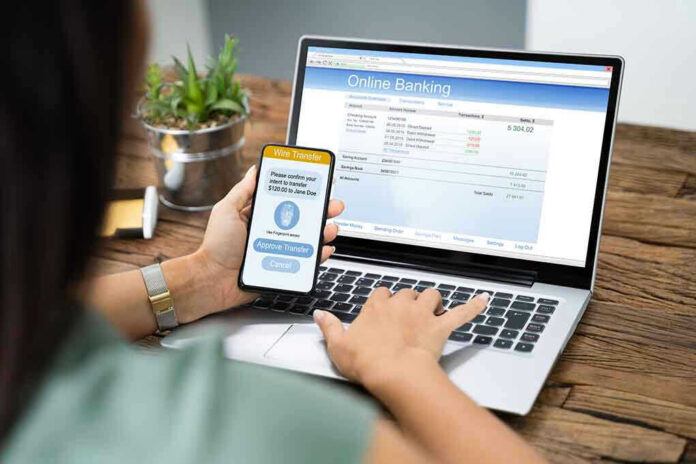 Person using online banking on laptop and smartphone.