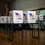 Voting booths set up in a room.