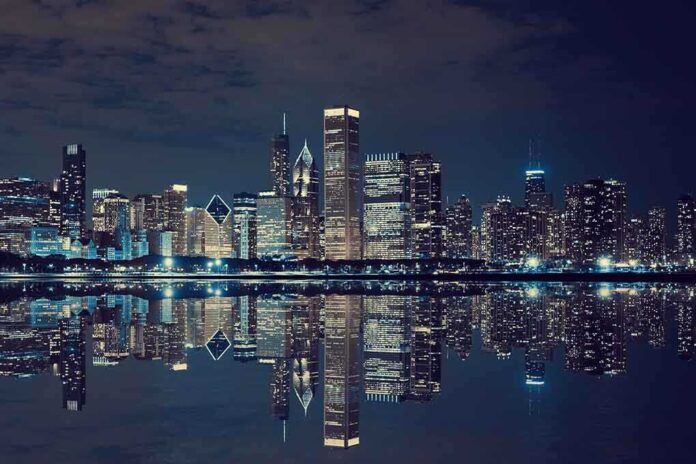 shutterstock_207683059.jpg Nighttime view of a city skyline with reflections on water