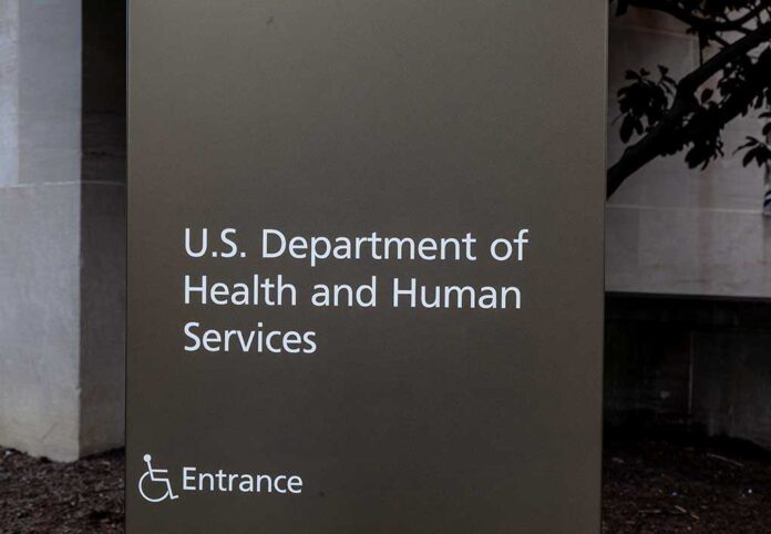 Sign for the U.S. Department of Health and Human Services with an entrance indication