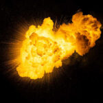 Bright, fiery explosion against a dark background.