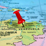 Senate Vote FAILS – Trump Gets War Powers Red pin on Venezuela, South America map.