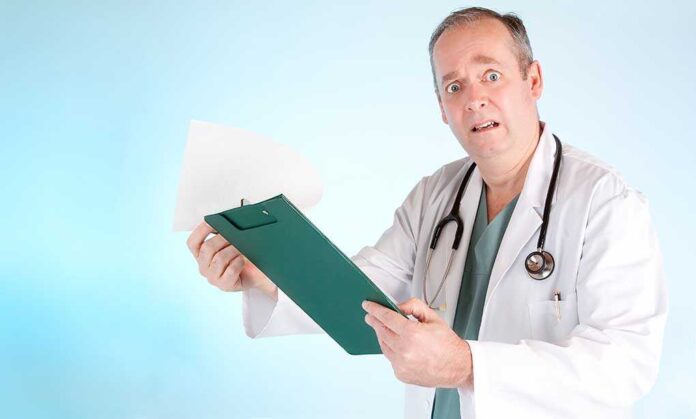 A doctor in a white coat looking surprised while holding a clipboard