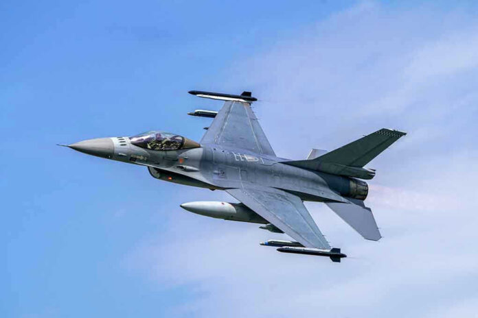 1629356173 Jet fighter flying through clear blue sky.