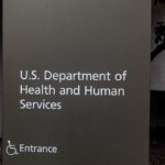 Sign for the U.S. Department of Health and Human Services with an entrance indication