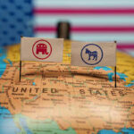 BRAZEN Dem Power Grab Could Wipe Out GOP Delegation Republican and Democratic flags on USA map background.