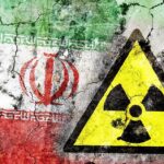 Rubble or Cover? Iran’s Hidden Arsenal A cracked wall featuring the Iranian flag and a nuclear warning symbol