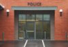 Middle School Teacher Ran WHAT?! – FBI Steps In Entrance of a modern police station with brick facade