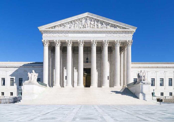 Us,Supreme,Court,,Washington,Dc The Supreme Court building featuring marble columns and a clear blue sky