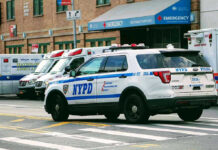 Penn Station Chaos: Five Slashed! Police car and ambulances outside emergency room entrance.
