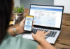 Person using online banking on laptop and smartphone.