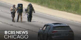 Massive police presence continues on Eisenhower Expy. after person is found dead in SUV