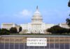 Senate Drops $70B Border Bomb View of the U.S. Capitol building with a security barrier in front