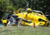Helicopter Crash-Lands on Top of Tourists yellow helicopter crash scene on grassy field