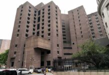 Epstein’s TOP Fixer Found Dead! Brutalist high-rise building with narrow windows and angular facades