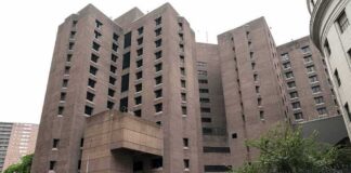 Brutalist high-rise building with narrow windows and angular facades