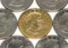 Trump Breaks 160-Year Rule – New Coin MINTED! A collection of coins featuring a gold coin surrounded by silver coins