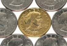 A collection of coins featuring a gold coin surrounded by silver coins