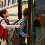 Children boarding a yellow school bus
