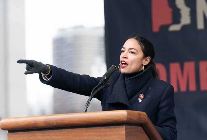 Woman speaking at a podium and pointing