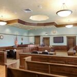 Lindsay Clancy Lawyer Stuns Court With Desperate Request Empty courtroom with wooden benches and judge's bench