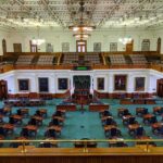 legislative chamber with desks and gallery seating