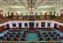 legislative chamber with desks and gallery seating