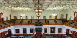 legislative chamber with desks and gallery seating