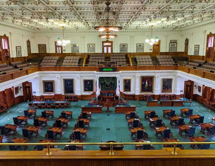 legislative chamber with desks and gallery seating