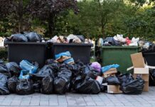 Mom Pleads Guilty – Murdered Newborn in Dumpster Overflowing dumpsters with piles of trash bags and cardboard