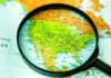 UN Snubs America In Latest Map Release Magnifying glass focusing on a map of the United States