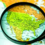 Magnifying glass focusing on a map of the United States