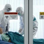 1,700 TRAPPED – Another Cruise Ship QUARANTINED! Healthcare workers in hazmat suits treat a patient in a quarantine room