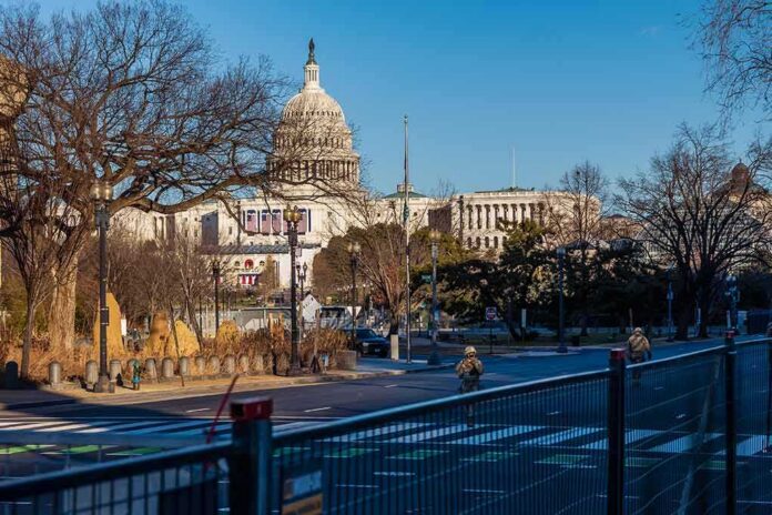 U.S. Capitol building behind security fencing and a quiet street