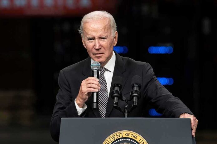 elderly man in suit speaking at a podium