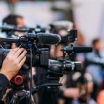 FBI Wire Inside Newsom’s Inner Circle REVEALED! Video cameras on tripods at a media event