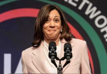 Kamala’s Blunder Sparks Viral Drunken Wine Mom Response woman at podium with two microphones