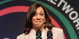woman at podium with two microphones
