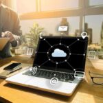 FBI Seize Congressman – Here’s What They CONFISCATED Laptop on desk showing cloud network icons
