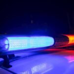 Police car light bar flashing blue and red at night