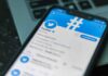 Talarico Mocks GOP Women, Calls Them All Strippers! Smartphone displaying Twitter app on a laptop keyboard