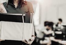 Person carrying a box of office items
